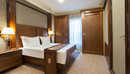 hotel room with wooden doors