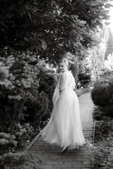 Fototapeta premium portrait of a happy bride in a light light dress in wearing elven accessories