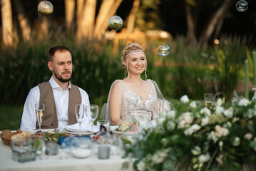 Fototapeta premium evening wedding family dinner in the forest
