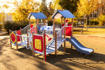 Playground house in the park. Fall season concept.