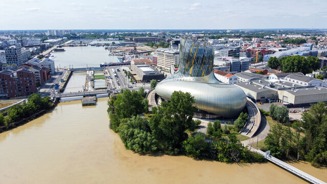 Aerial view of the Cité du Vin, the Wine Museum of Bordeaux in France - Modern discovery center dedicated to oenology and viticulture built with glass and metal on the banks of the river Garonne