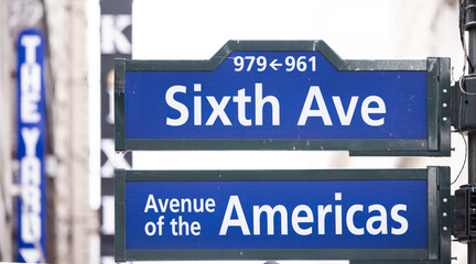 New York, USA: Sixt avenue and Avenue of America street  signs in Manhattan 
