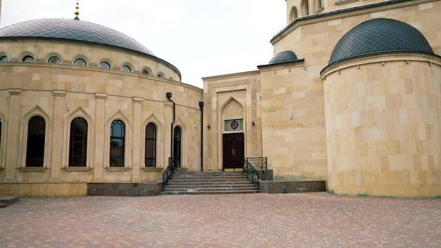 Wooden doors for the entrance to Muslim mosque for prayers of people of the faith of Islam