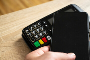  Closeup of payment terminal with banking concept, visible keypad.