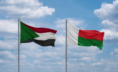 Madagascar and Sudan flags, country relationship concept