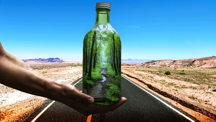 Hand Holding Bottled Forest in Arid Desert Landscape for Eco-Friendly Conservation, Nature Preservation, and Climate Change Adaptation Concept 