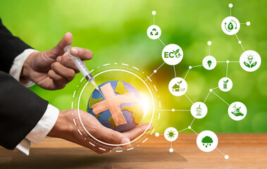 Businessman using string injecting vaccine to save Earth symbolize corporate ESG commitment,...