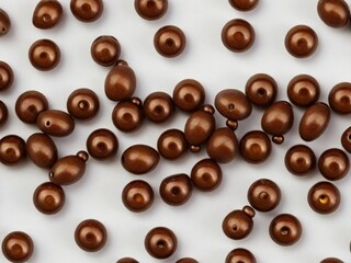 brown beads on white surface 
