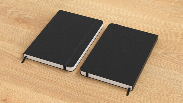 Black cover notebook mockup on wooden background