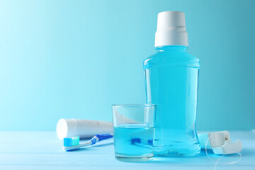 A mouthwash on a colored background. Dental care, dental health.