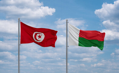 Madagascar and Tunisia flags, country relationship concept
