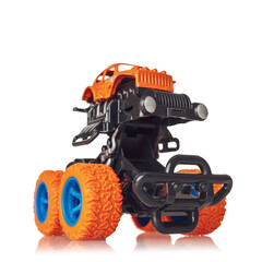 Naklejka premium Jeep car toy with big wheels, monster truck big foot children's toy, isolated on white background