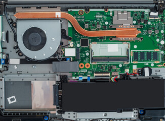 disassembled laptop with visible internal parts