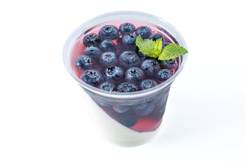 panna cotta with black currants on a white background for a food delivery site 1