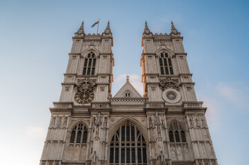 Fototapeta na wymiar Main facade of Westminster Abbey against blue sky , Gothic style, in London, England, United Kingdom