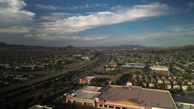 Aerial above highway and shopping center in Henderson Nevada