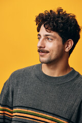 Fototapeta premium Cheerful man sweater adult student trendy happy attractive smile portrait orange background style casual fashion