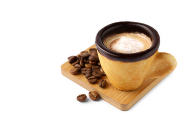Delicious edible biscuit cup with coffee and roasted beans on white background, space for text
