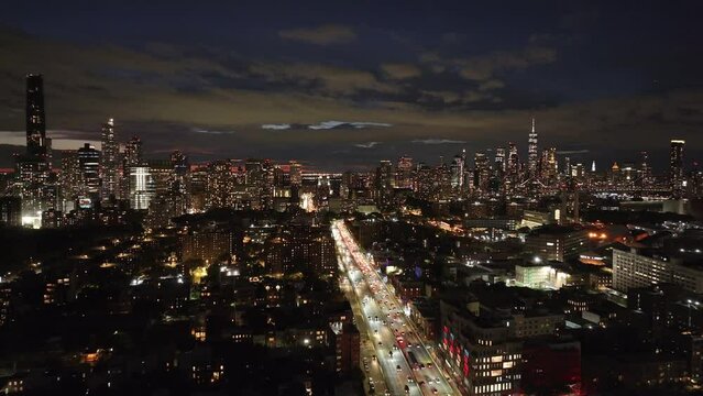 Aerial view of The Brooklyn Queens Expressway cutting through Brooklyn at night