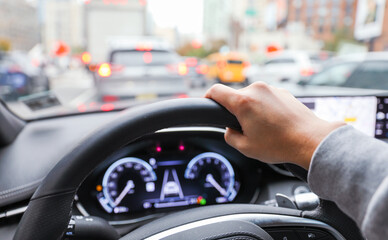 hands firmly grip a steering wheel, symbolizing control, safety, and the journey of life. It...