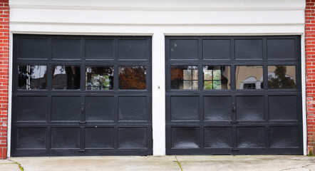 Fototapeta na wymiar garage door stands tall, symbolizing security and convenience. A gateway to shelter cars and storage, it complements the home's aesthetic while ensuring protection