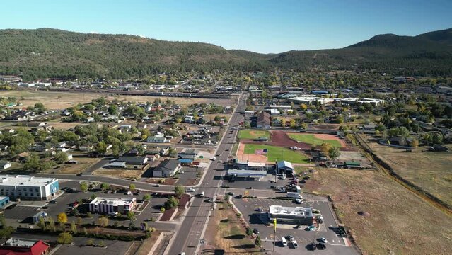 Aerial above neighborhoods in tourist town of Williams Arizona in fall