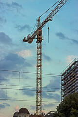 Crane boom structure and metal sling on blue sky