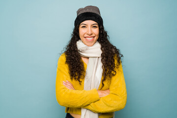 Beautiful smiling woman happy about the winter cold weather