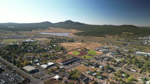 Aerial above small tourist town of Williams Arizona on Interstate 40 in fall