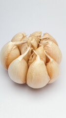ONE GARLIC CLOVE WITH WHITE BACKGROUND