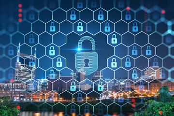 Panoramic view of Broadway district of Nashville over Cumberland River at illuminated night skyline, Tennessee, USA. Padlock hologram. The concept of cyber security to protect confidential information