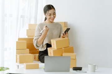 Small start-up business owners checking parcels at work, salespeople, checking production orders....