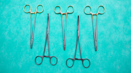 Flat lay of Halsey Needle Holder and stainless medical scissor. Medical instruments. Medical Surgical Instrument. Equipment used in surgery.