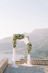 Wedding arch stands on an observation deck in the mountains