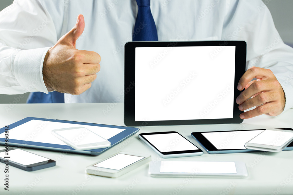 Poster digital png photo of man with tablets and smartphones with copy spaces on transparent background