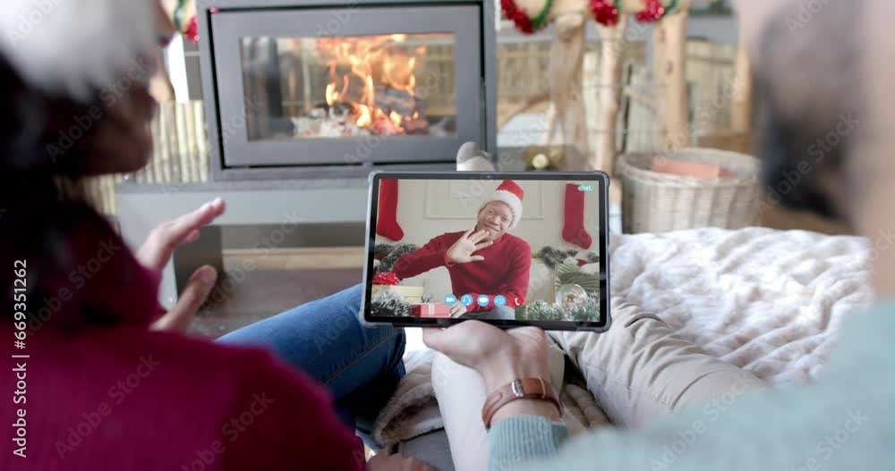 Sticker Happy diverse couple and male friend having christmas tablet video call, slow motion