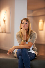 Thinking, creative and woman at a gallery for art, exhibition or education on culture. Idea,...