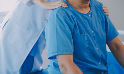 Fototapeta premium Physiotherapist working with patient in clinic, closeup