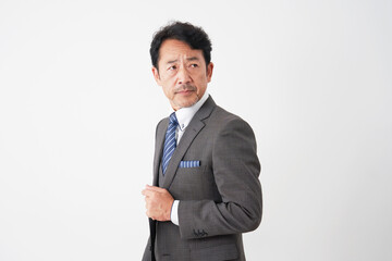 中年のビジネスマンのポートレート　白背景