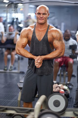 Man, arm flex and mirror at gym with fitness, workout and exercise of bodybuilder with reflection. Muscle, male person and athlete with sport training, wellness and body builder at a health club