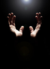 Hands, prayer and help from God with praise, closeup of holy person with gratitude and respect for religion. Guide, wellness and praying, worship and faith with hope and trust on dark background - obrazy, fototapety, plakaty