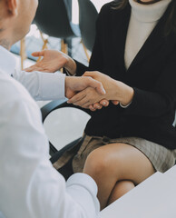 .Business handshake for teamwork of business merger and acquisition,successful negotiate,hand shake,two businessman shake hand with partner to celebration partnership and business deal concept