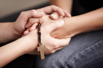 Holding hands, prayer together with beads and help for religion, trust and spiritual hope. Support,...