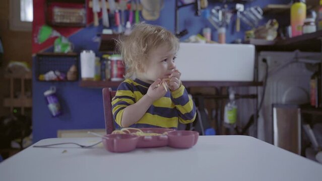 Boy Eating Spaghetti At Table In Kitchen - Fairbanks, Alaska