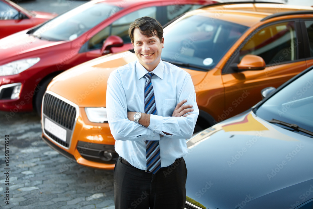 Wall mural portrait, smile and a man arms crossed at a dealership for car sale in a commercial parking lot. bus