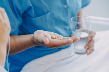 Women Asian doctors hold the patient hand and encourage and provide medical advice While checking...
