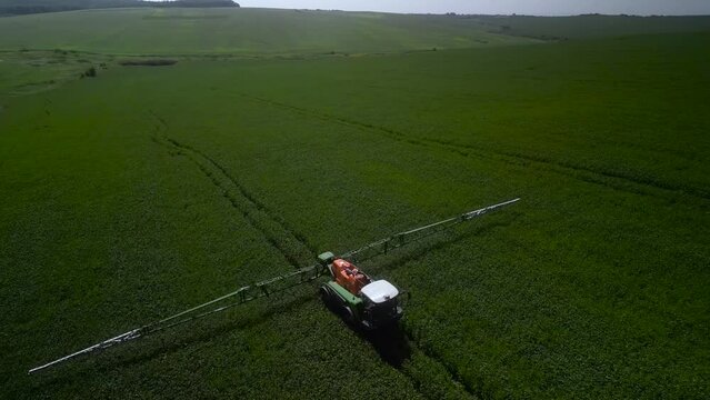 Spray Fertilize On Field With Chemicals In Agriculture Field