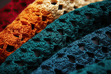 some croches that are all different colors and sizes on a black surface with red, orange, yellow, blue, green