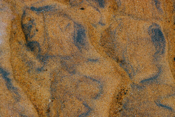 Natural river sand with iron particles texture