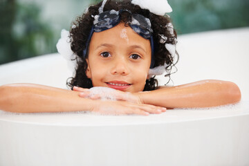 Portrait, children and bath with a boy in goggles while cleaning his skin in the home for natural...